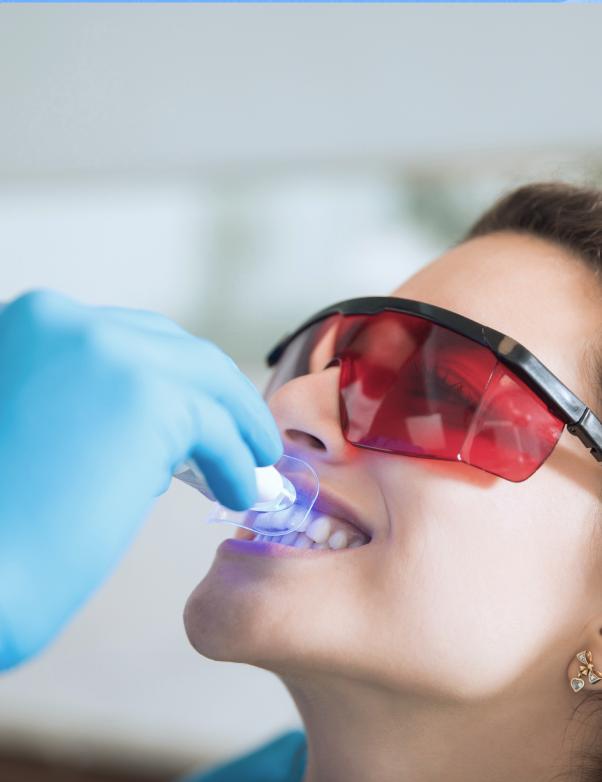 Patient receiving a cosmetic whitening treatment